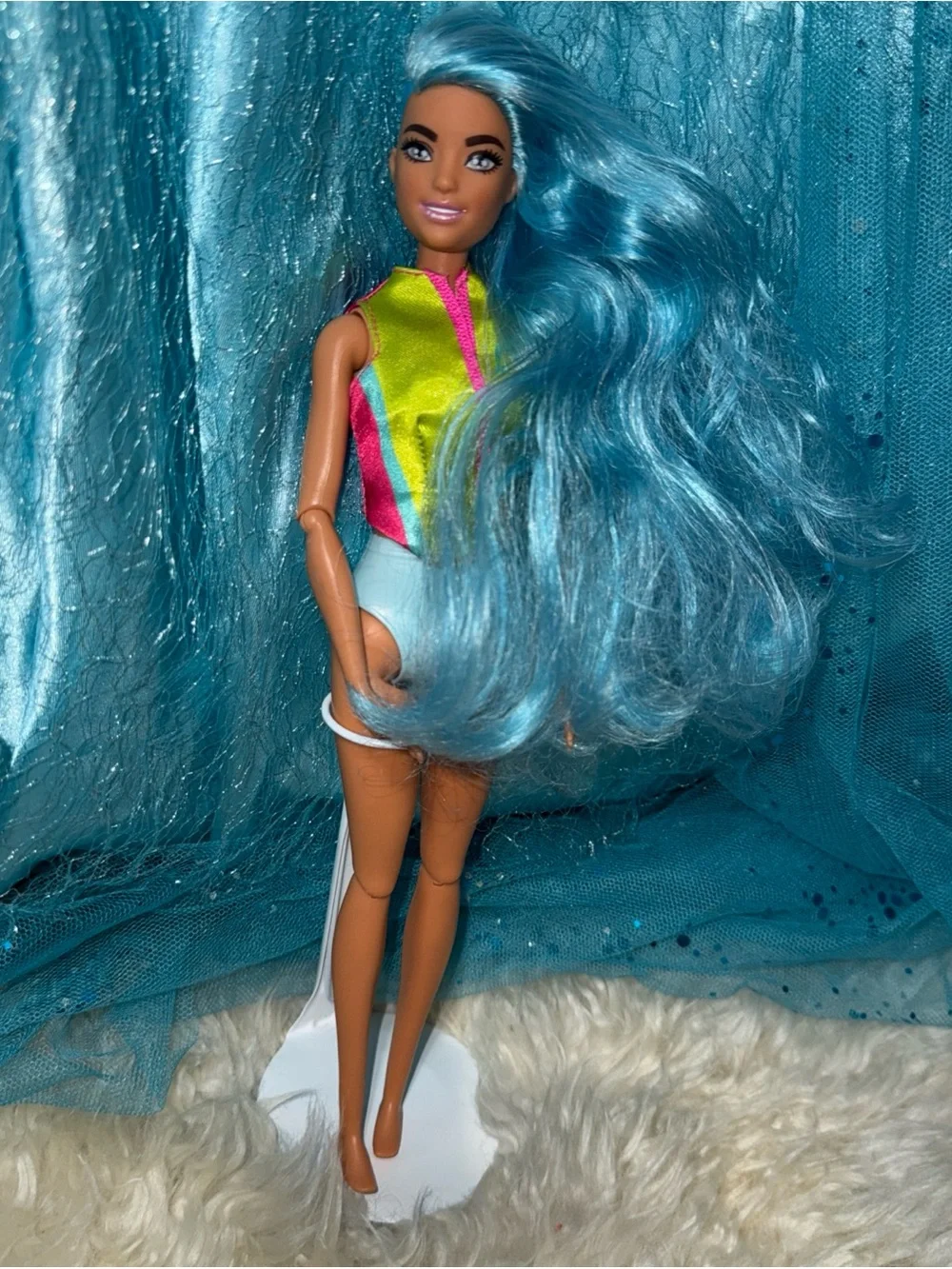 Barbie blue hair shaved head in life jacket top